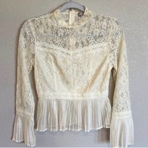 Elegant Cream Lace Blouse with Pleated Hem